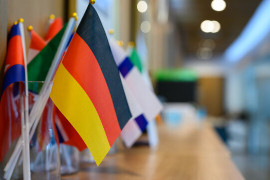Germany flag with World flags together on the table with copy space for text.