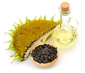 Sunflower seeds and oil on white background