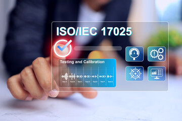 Laboratory management concept with businessman pointing on iso iec 17025 testing and calibration laboratory standards to approve test result for instrument calibration and products certification