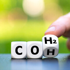 Chemical formula representation with cubes showing CO, H, and H2, symbolizing fuel cell technology and energy innovation