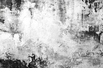 Abstract grayscale texture of a weathered wall.  Layers of paint and decay create a mottled effect