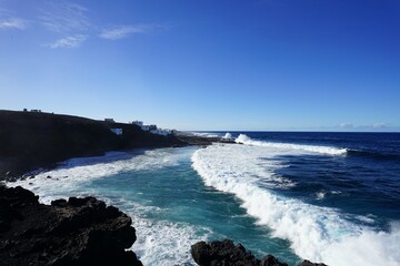 “Natural rugged beach landscape with powerful ocean waves in Lanzarote”