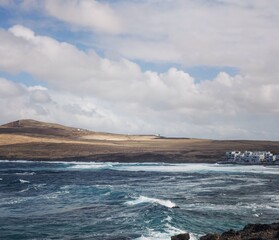 “Natural rugged beach landscape with powerful ocean waves in Lanzarote”