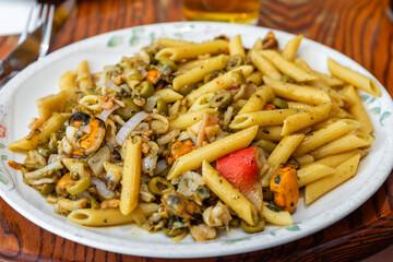 Plate of seafood penne pasta served in a restaurant in Mdina, Malta.