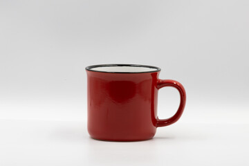 Red mug standing on white background