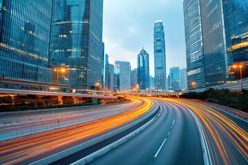 Fototapeta premium Hong Kong's Dynamic Urban Landscape: A Stunning Long Exposure Capturing City Lights and Modern Architecture at Twilight