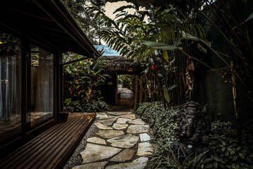 Tropical Garden Pathway with Ganesha Statue in Ubatuba, Brazil