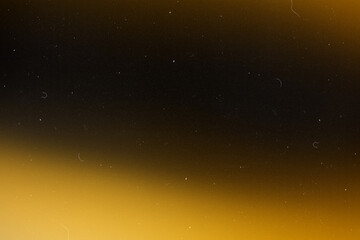 retro film overlay effect with scratch dust and yellow gradient light leaks,retro grain noisy film distressed texture light leak flare on black background,old film projector