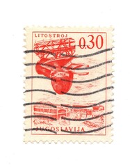A vintage postage stamp from Yugoslavia isolated on a white background.