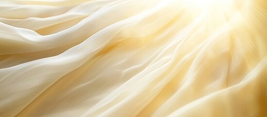 Fototapeta premium Heavenly Light Cascading Over Delicate, Flowing Cream-Colored Drapery