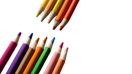 Crayons and coloring book pages laid out on white background
