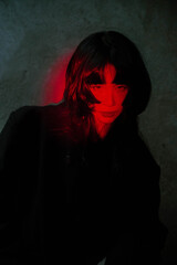 Portrait of a female model in red lighting.