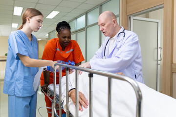 Emergency medical team rushing patient on stretcher