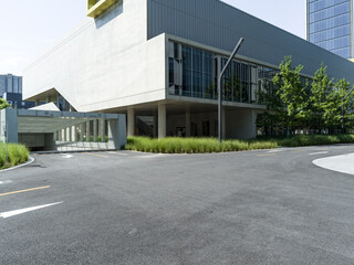 enpty asphalt road with modern office building