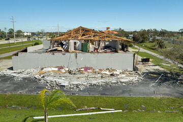 Natural disaster and its consequences. Hurricane Ian destroyed house roof and walls in Florida...