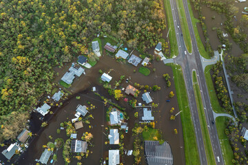 Consequences of natural disaster. Heavy flood with high water surrounding residential houses after...