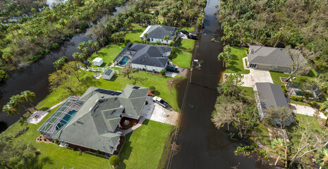 Surrounded by hurricane Ian rainfall flood waters homes in Florida residential area. Aftermath of...
