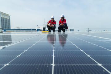 Engineers inspecting rooftop solar panel installation