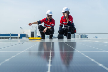 Engineers inspecting rooftop solar panel installation