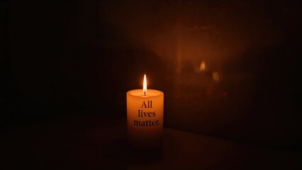 The phrase All lives matter shown in a candlelit room