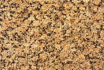 Texture of stone with yellow tint. Rock background. Stone