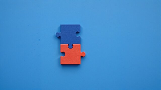 A set of four distinct jigsaw pieces fitting perfectly around a goal icon on a minimalist blue background, representing collaboration and partnership.