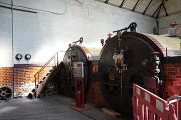 Papplewick Pumping Station, Nottingham, England – August 10 2025: Victorian boiler room interior showing brickwork and steam gauges
