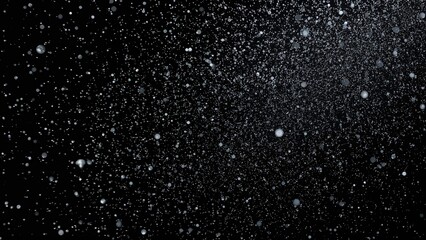 Thousands of Shimmering Star Dust, Visual of Heavy Snow and Rain Droplets Descending, Strong Snowstorm in Flight. Sharp Freeze Shot on Black Background. Spray, Fog, and Smoke Representing Star-Like