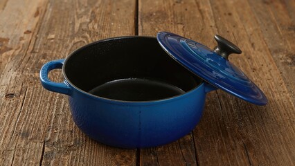 Covered blue cast iron pot sitting on a table