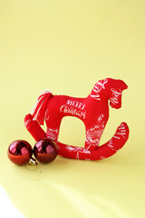 Horse, sewn by the hands of a craftswoman. Symbol of 2026. Red Fire Horse on a yellow background.