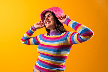 Smiling young woman expressing joyful confidence in studio