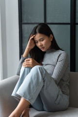 Young Asian Woman Feeling Lonely Sad Sick Stressed on Sofa at Home Alone for Healthcare Wellness...