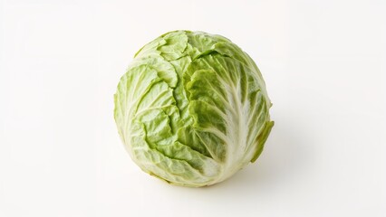 Fototapeta premium Fresh Iceberg Lettuce with Green Leaves on a White Surface