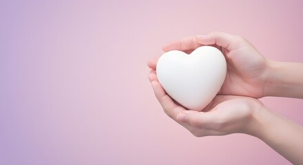 Obraz premium Hands gently holding a white heart against a soft pink and purple gradient background image scene