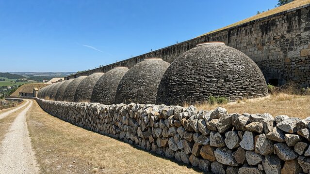 Centuries-old narrow stone granaries constructed to keep and dry harvested grain.