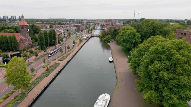 Aerial view of Diemen, Sint Petrus Banden Church and Weespertrekvaart canal