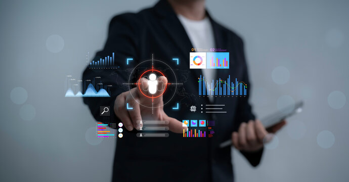 Businessman pointing virtual target audience icon surrounded by analytics charts and data dashboard, customer segmentation, market research, AI-driven business intelligence - Powered by Adobe