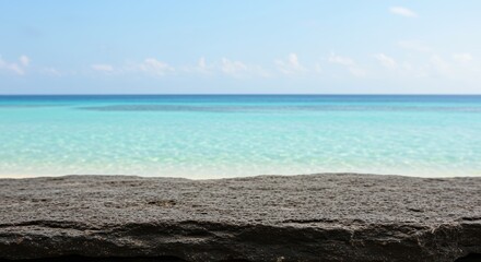 Ocean Serenity: a captivating seascape featuring a pristine, turquoise ocean meeting a vast sky in a moment of pure, uninterrupted tranquility.