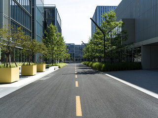 enpty asphalt road with modern office building