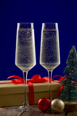 An Elegant Holiday Toast Featuring Sparkling Glasses and Beautiful Festive Decorations