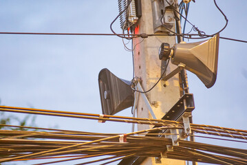 Urban Utility Pole with Loudspeakers and Wires