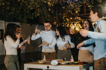 A lively gathering of friends having fun outdoors, sharing laughter, food, and drinks under decorative lights, creating a joyous and festive atmosphere moments of celebration.