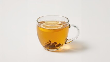 Clear cup filled with lemon-infused detox tea and fresh lemon slices against a white background