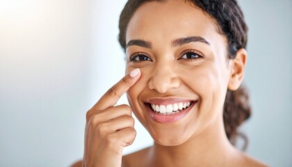 Close-Up Portrait of a Happy Woman with Natural Curly Hair, Demonstrating the Gentle Application of a Skincare Product