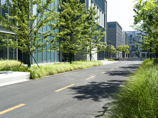 enpty asphalt road with modern office building