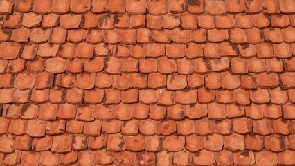Patterned texture of ceramic roof tiles in orange