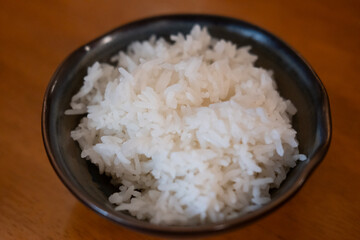 A bowl of rice served on the table