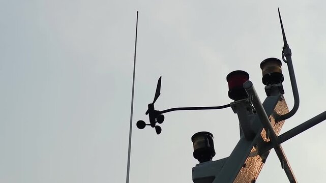 Navigation radar tower and Anemometer to measure wind speed to assist in the operation of ship navigation at sea or sailing. Military navigation on vessel. Marine navigation and antenna on board.  4K 