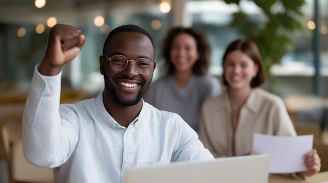 Team Celebrating Nonprofit Grant Approval in Community Office