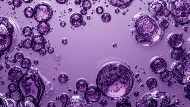 Spherical bubbles gathered into diverse patterns alongside scattered ones on a shaded background, creating a mysterious and scientific atmosphere.